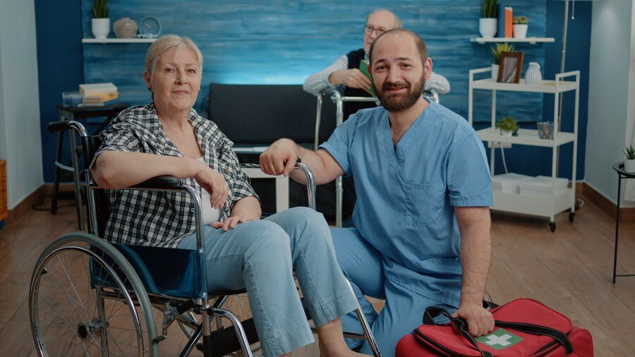 portrait-senior-woman-wheelchair-man-nurse_482257-18009